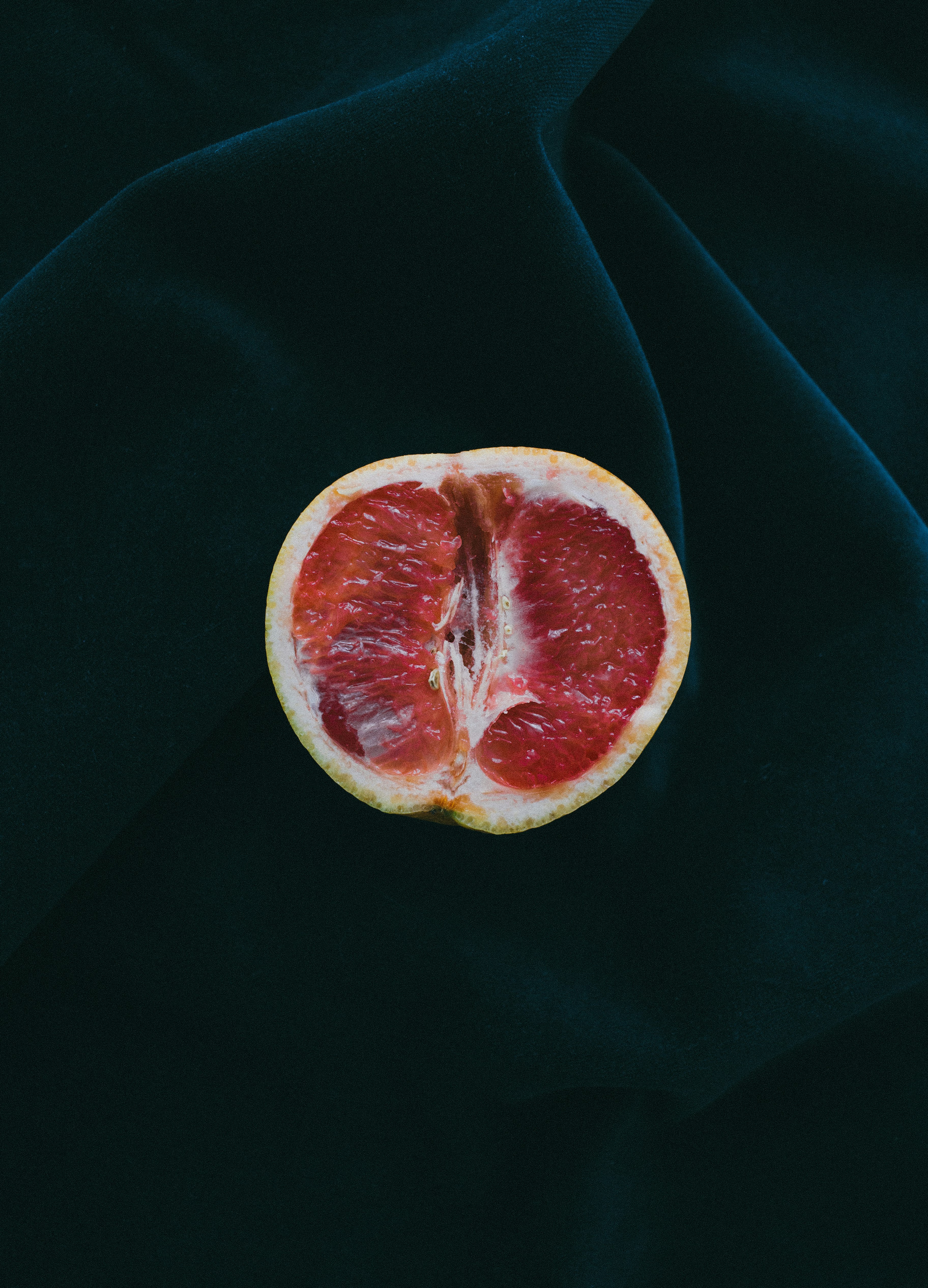 grapefruit on black surface